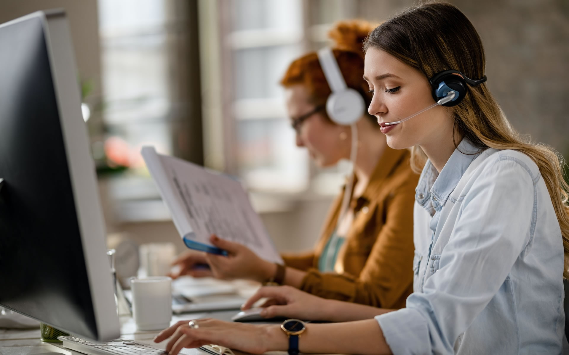 Callout Network adviser helping a customer by phone in a UK office